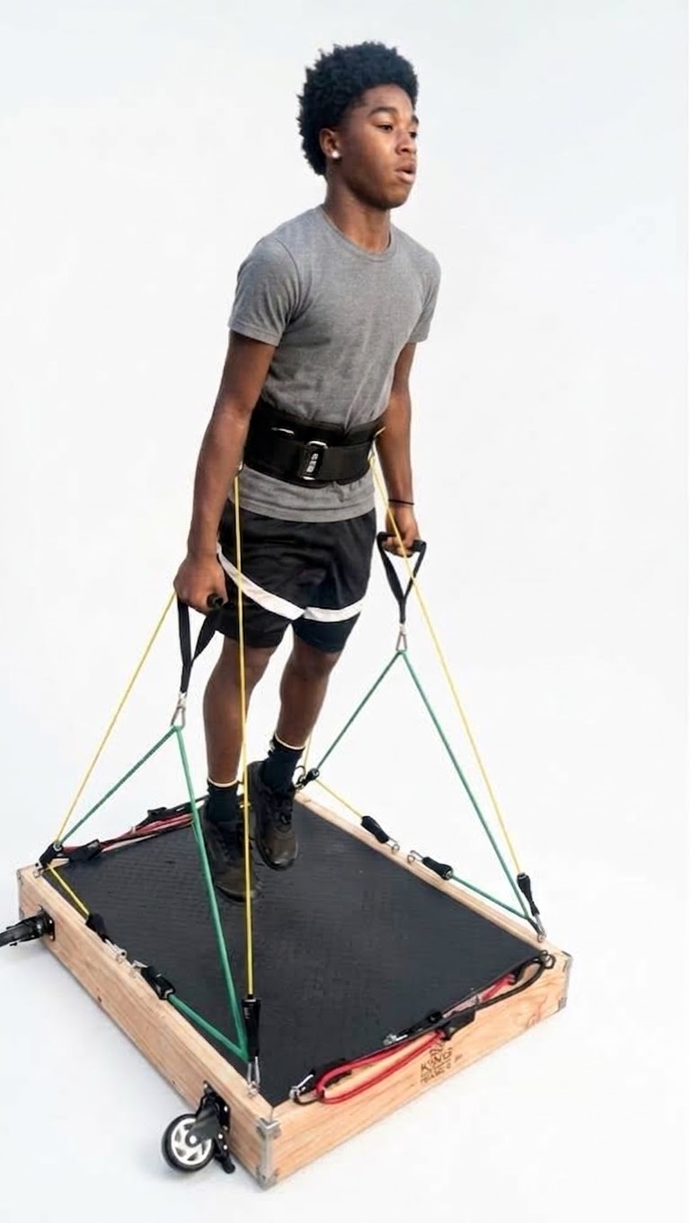 Athlete training on the King Resistance Trainer with waist belt and resistance bands
